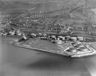 Ardrossan Refinery, Ardrossan Harbour.  Oblique aerial photograph taken facing east.