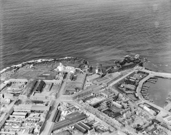 Fraserburgh, general view, showing Kinnaird Head Lighthouse and Bath Street.  Oblique aerial photograph taken facing north-east.