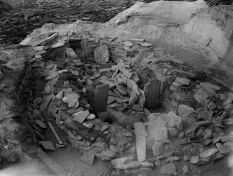 View of house 2 in partially cleared state during excavations of Knap of Howar settlement, Papa Westray, in 1929.

