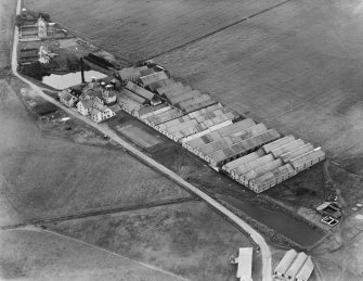 Glenlivet Distillery, Ballindalloch.  Oblique aerial photograph taken facing west.