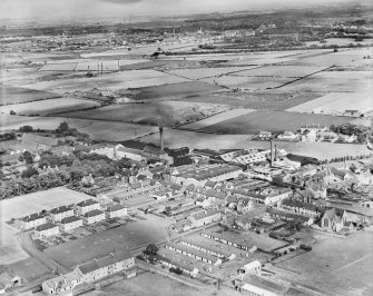 Linwood, general view, showing R and W Watson Ltd. Linwood Paper Mill and Bridge Street.  Oblique aerial photograph taken facing east.