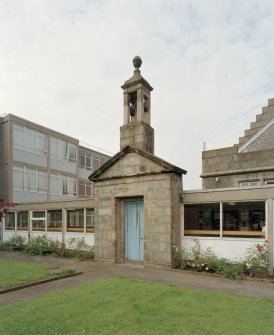 Entrance doorway and bellcote from 'Old Grammar School' now built into corridor linking main building to extensions at rear. View from NE