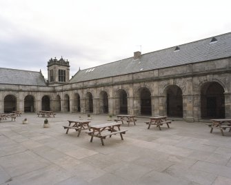 General view of South block, courtyard and cloisters from North East