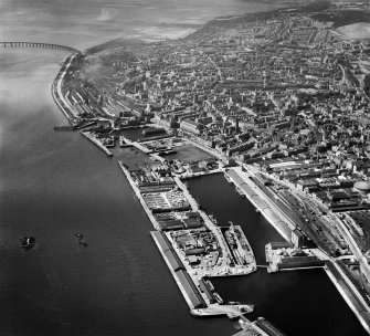 Dundee, general view, showing the Docks and Tay Bridge.  Oblique aerial photograph taken facing west.