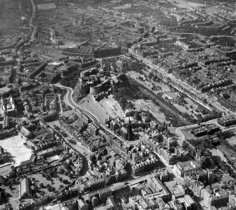 Edinburgh, general view, showing Edinburgh Castle and Princes Street Gardens.  Oblique aerial photograph taken facing west.