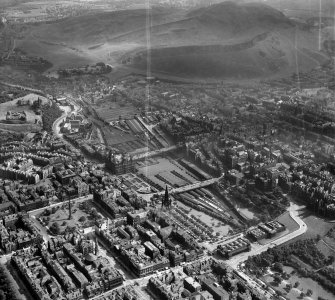 Edinburgh, general view, showing Waverley Station and Holyrood Park.  Oblique aerial photograph taken facing east.