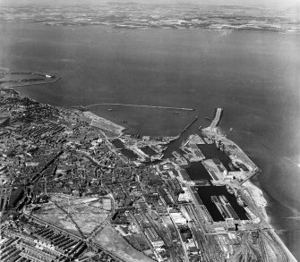 Edinburgh, general view, showing Leith Docks and Leith Links.  Oblique aerial photograph taken facing north.
