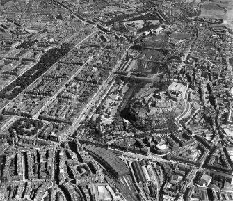 Edinburgh, general view, showing Princes Street and Edinburgh Castle.  Oblique aerial photograph taken facing east.