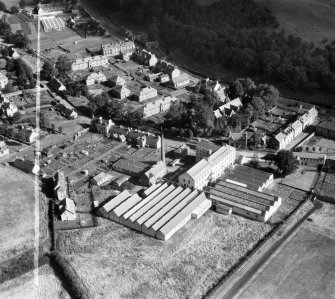 Ballantyne's Cashmere Caerlee Mills, Damside, Innerleithen.  Oblique aerial photograph taken facing north-east.  This image has been produced from a crop marked negative.