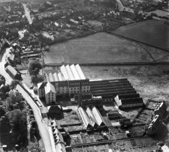 Ballantyne's Cashmere Caerlee Mills, Damside, Innerleithen.  Oblique aerial photograph taken facing south.