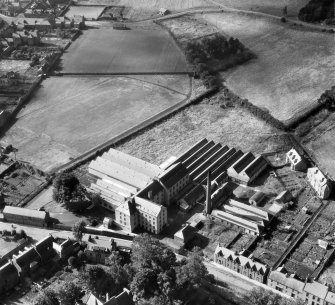 Ballantyne's Cashmere Caerlee Mills, Damside, Innerleithen.  Oblique aerial photograph taken facing south-west.