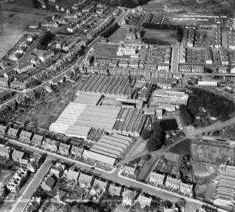Ballantyne Brothers and Co. Ltd. March Street Mills, Peebles.  Oblique aerial photograph taken facing north-west.  This image has been produced from a crop marked negative.