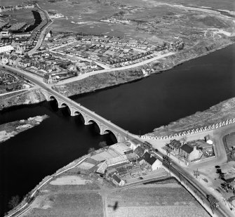 Aberdeen, general view, showing Bridge of Don and Donmouth Road.  Oblique aerial photograph taken facing north-east.