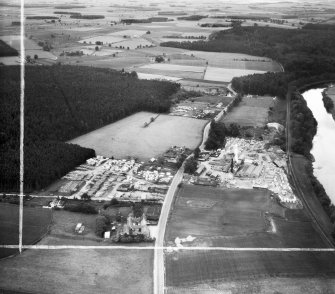 A and G Paterson Ltd. Silverbank Saw Mills, Banchory.  Oblique aerial photograph taken facing east.  This image has been produced from a crop marked negative.