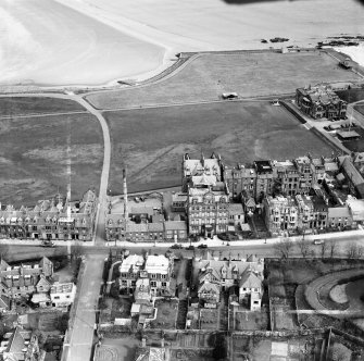 St Andrews, general view, showing Rusack's Hotel, Pilmour Links and Royal and Ancient Golf Club, Golf Place.  Oblique aerial photograph taken facing north.  This image has been produced from a crop marked negative.