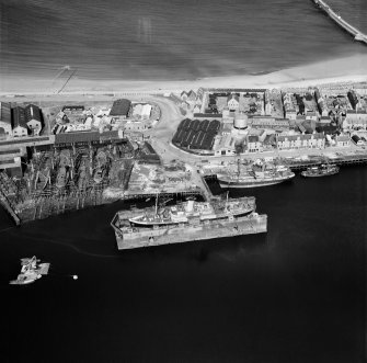 Dry Dock, Pocra Quay and Alexander Hall and Co. Ltd Shipyards, Aberdeen Harbour.  Oblique aerial photograph taken facing east.