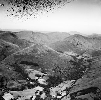 Glen Luss, general view, showing The Paps and Mid Hill.  Oblique aerial photograph taken facing west.  This image has been produced from a damaged negative.