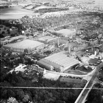 Dunfermline, general view, showing Winterthur Silks Ltd. Canmore Works, Bruce Street and Pilmuir Works, Pilmuir Street.  Oblique aerial photograph taken facing north-east.  This image has been produced from a crop marked negative.