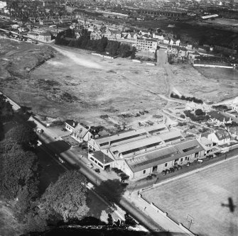 Millars Garage, Callendar Road and Bellsmeadow, Falkirk.  Oblique aerial photograph taken facing north.  This image has been produced from a crop marked negative.