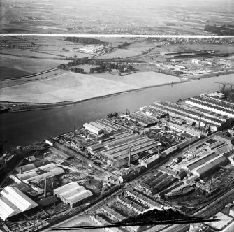 Glasgow, general view, showing Mechans Ltd. Scotstoun Ironworks, South Street and Harland and Wolff Diesel Engine Works, Balmoral Street.  Oblique aerial photograph taken facing south-west.  This image has been produced from a damaged and crop marked negative.