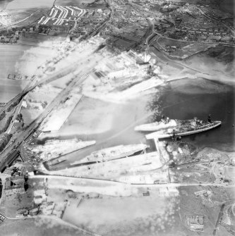 Thomas Ward and Sons Shipbreaking Yard and Caldwells Paper Mill, Inverkeithing.  Oblique aerial photograph taken facing north.  This image has been produced from a damaged negative.