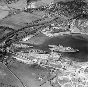 Thomas Ward and Sons Shipbreaking Yard and Caldwells Paper Mill, Inverkeithing.  Oblique aerial photograph taken facing north.