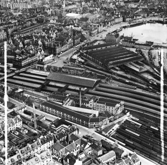 Aberdeen, general view, showing Wiggins Teape Ltd. Pirie Appleton and Co. Paper Mills, College Street and Aberdeen Joint Railway Station.  Oblique aerial photograph taken facing north-east.  This image has been produced from a crop marked negative.