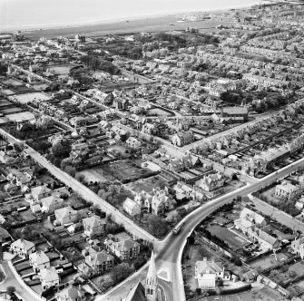Ayr, general view, showing Carrick House, Carrick Road and Ayr St Columba Church, Midton Road.  Oblique aerial photograph taken facing north-west.