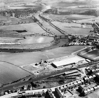 Glasgow, general view, showing Hoover (Electric Motors) Ltd. Cambuslang Works, Somervell Street and Cambuslang Bridge.  Oblique aerial photograph taken facing east.