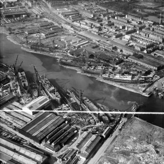 Alexander Stephen and Sons Ltd. Linthouse Shipyard and Barclay, Curle and Co. Ltd. Clydeholm Shipyard, South Street, Glasgow.  Oblique aerial photograph taken facing north.  This image has been produced from a crop marked negative.