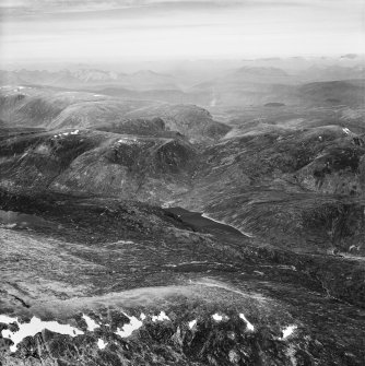 Loch na Caoidhe and Sgurr Coire nan Eun, Strathconon Forest.  Oblique aerial photograph taken facing north-west.