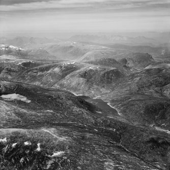 Loch na Caoidhe and Sgurr Coire nan Eun, Strathconon Forest.  Oblique aerial photograph taken facing north-west.