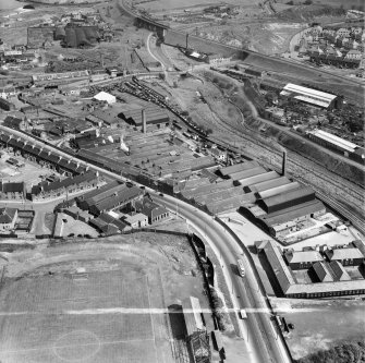 Stewarts and Lloyds Ltd. Works, Main Street, Coatbridge.  Oblique aerial photograph taken facing south-east.  This image has been produced from a crop marked negative.