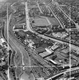 Stewarts and Lloyds Ltd. Works, Main Street and Albion Rovers Football Ground, Coatbridge.  Oblique aerial photograph taken facing west.  This image has been produced from a crop marked negative.