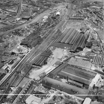 Coatbridge, general view, showing Stewarts and Lloyds Ltd. Calder Tube Works and Stewarts and Lloyds Ltd. Works, Main Street.  Oblique aerial photograph taken facing east.  This image has been produced from a crop marked negative.