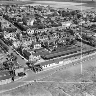 Carnoustie, general view, showing Station Hotel, Station Road and Church Street.  Oblique aerial photograph taken facing north.  This image has been produced from a crop marked negative.