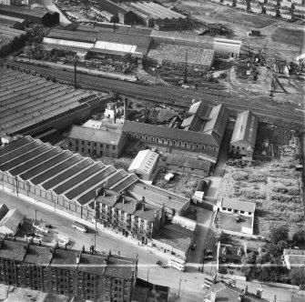 British Dyewood Co. Ltd. Carntyne Dyewood Mills, Shettleston Road and Parkhead Crane Works, Rigby Street, Glasgow.  Oblique aerial photograph taken facing north.  This image has been produced from a crop marked negative.