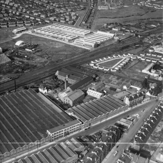Glasgow, general view, showing British Dyewood Co. Ltd. Carntyne Dyewood Mills, Shettleston Road and Carntyne Station.  Oblique aerial photograph taken facing north-east.  This image has been produced from a crop marked negative.