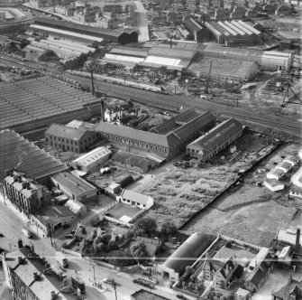 British Dyewood Co. Ltd. Carntyne Dyewood Mills, Shettleston Road and Parkhead Crane Works, Rigby Street, Glasgow.  Oblique aerial photograph taken facing north-west.  This image has been produced from a crop marked negative.