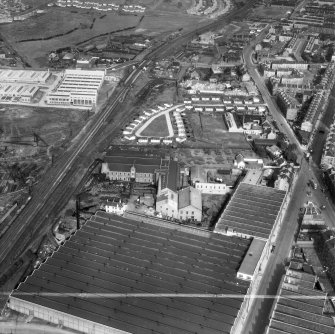 Glasgow, general view, showing British Dyewood Co. Ltd. Carntyne Dyewood Mills, Shettleston Road and Carntyne Station.  Oblique aerial photograph taken facing east.  This image has been produced from a crop marked negative.