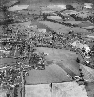 Denny, general view, showing Cruikshank and Co. Ltd. Denny Iron Works, Glasgow Road and Denny Gasworks.  Oblique aerial photograph taken facing north.  This image has been produced from a crop marked negative.