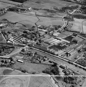 Bonnybridge Gasworks and Smith and Wellstood Ltd. Columbian Stove Works, Bonnybridge.  Oblique aerial photograph taken facing east.  This image has been produced from a crop marked negative.