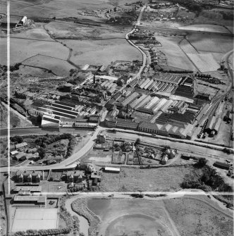 Bonnybridge Gasworks and Smith and Wellstood Ltd. Columbian Stove Works, Bonnybridge.  Oblique aerial photograph taken facing south-east.  This image has been produced from a crop marked negative.