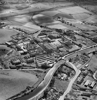 Bonnybridge Gasworks and Smith and Wellstood Ltd. Columbian Stove Works, Bonnybridge.  Oblique aerial photograph taken facing south.  This image has been produced from a crop marked negative.