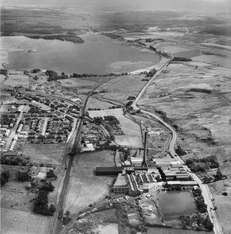 Caldercruix, general view, showing Robert Craig and Sons Ltd. Caldercruix Paper Mills, Airdrie Road and Hillend Reservoir.  Oblique aerial photograph taken facing east.