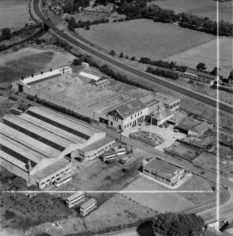 M and C Switchgear Ltd. Kelvinside Works, Kirkintilloch.  Oblique aerial photograph taken facing north-east.  This image has been produced from a crop-marked negative.