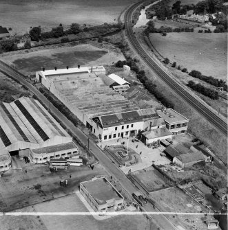 M and C Switchgear Ltd. Kelvinside Works, Kirkintilloch.  Oblique aerial photograph taken facing north.  This image has been produced from a crop marked negative.