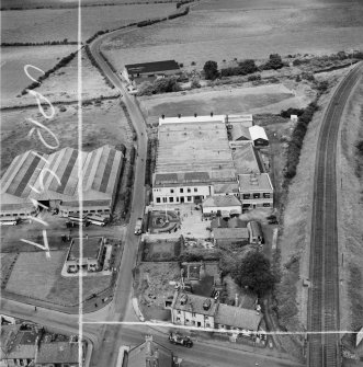 M and C Switchgear Ltd. Kelvinside Works, Kirkintilloch.  Oblique aerial photograph taken facing north.  This image has been produced from a crop marked negative.