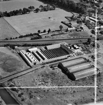 M and C Switchgear Ltd. Kelvinside Works, Kirkintilloch.  Oblique aerial photograph taken facing east.  This image has been produced from a crop marked negative.