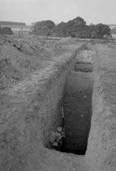 W defences, rampart, Flavian I and Flavian II ditches.